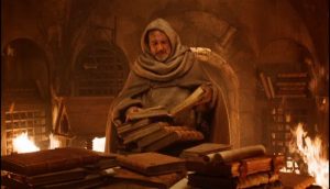 Guilaume de Baskerville dans la bibliothèque interdite de l'abbaye.